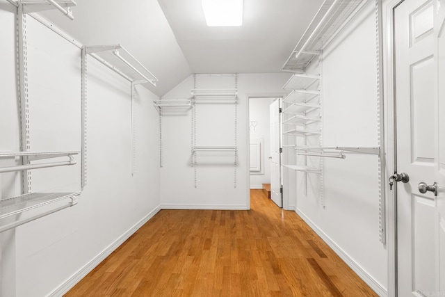 walk in closet featuring light wood-style flooring