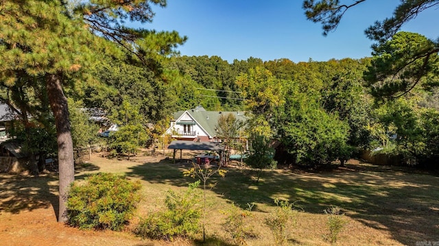 birds eye view of property with a wooded view