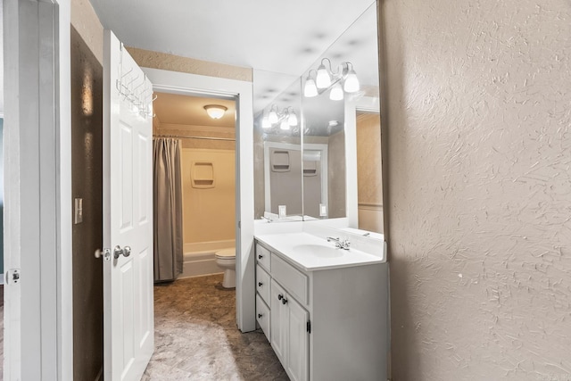 full bath featuring toilet, a textured wall, shower / bath combo with shower curtain, and vanity