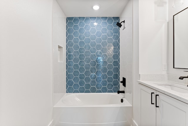 bathroom with recessed lighting, bathing tub / shower combination, and vanity