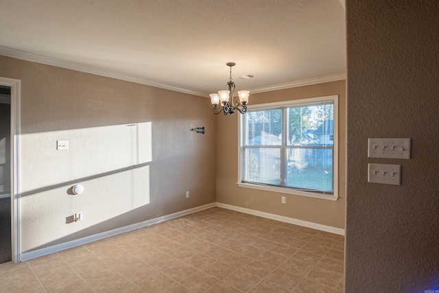 empty room featuring baseboards, ornamental molding, and a notable chandelier