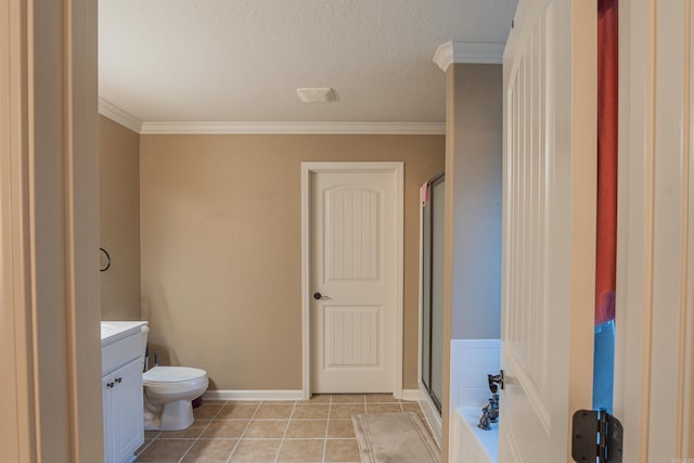 bathroom with crown molding, a shower stall, vanity, baseboards, and tile patterned floors