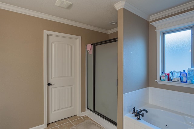 bathroom featuring a shower stall, crown molding, a garden tub, and tile patterned floors