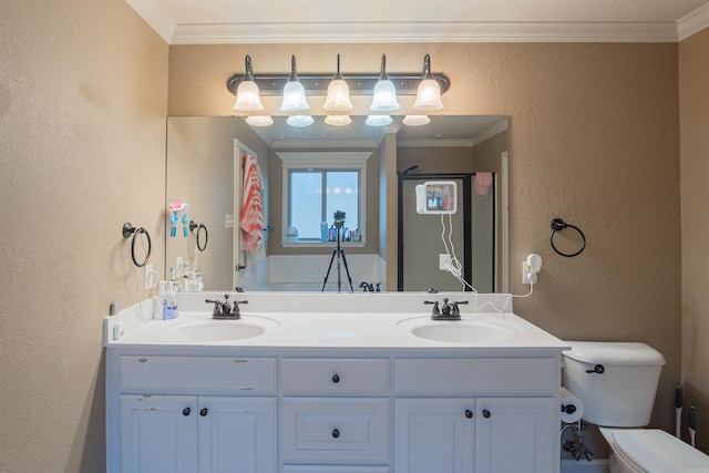 full bathroom featuring a textured wall, ornamental molding, a sink, and toilet