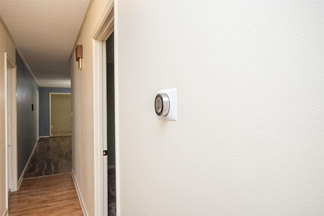 681 Sharp Ave, Camden, AR 71701 - hallway featuring wood finished floors and a textured ceiling