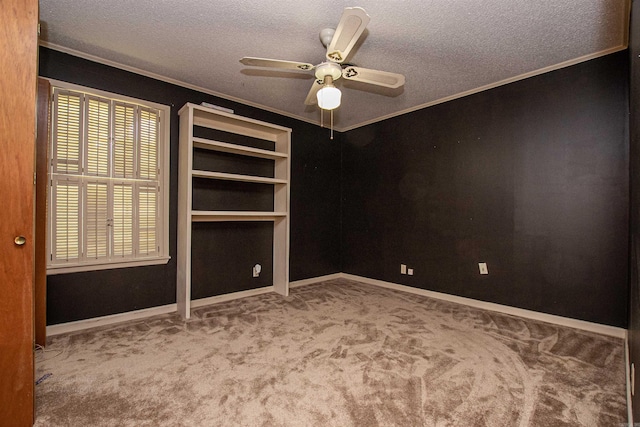 681 Sharp Ave, Camden, AR 71701 - carpeted empty room with ornamental molding, a textured ceiling, and a ceiling fan