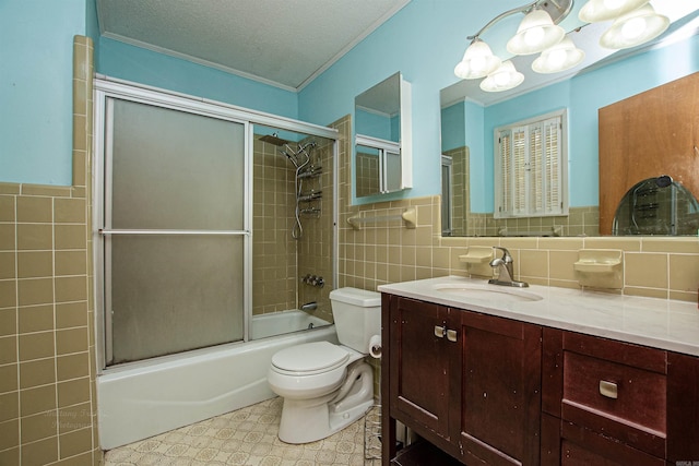 681 Sharp Ave, Camden, AR 71701 - full bathroom with tile walls, ornamental molding, vanity, tile patterned floors, and enclosed tub / shower combo