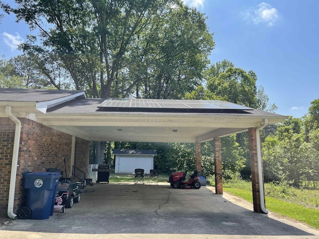 681 Sharp Ave, Camden, AR 71701 - view of vehicle parking featuring a storage unit and an attached carport