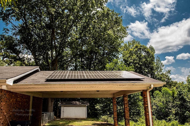 681 Sharp Ave, Camden, AR 71701 - view of parking with a storage shed, a carport, and view of wooded area