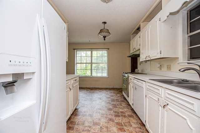 681 Sharp Ave, Camden, AR 71701 - kitchen featuring white appliances, under cabinet range hood, white cabinetry, and light countertops