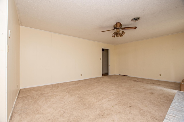681 Sharp Ave, Camden, AR 71701 - spare room featuring ceiling fan, light carpet, and a textured ceiling