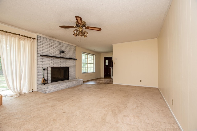 681 Sharp Ave, Camden, AR 71701 - unfurnished living room with ceiling fan, a brick fireplace, carpet flooring, and a textured ceiling