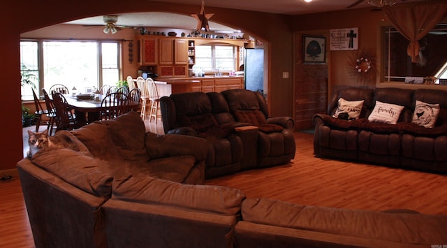 708 Kid Phillips Rd, Marshall, AR 72650 - living room featuring ceiling fan, light wood finished floors, and arched walkways