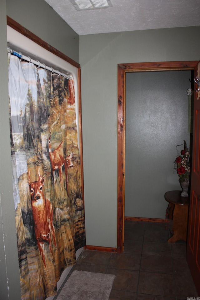 708 Kid Phillips Rd, Marshall, AR 72650 - corridor with a textured ceiling and baseboards