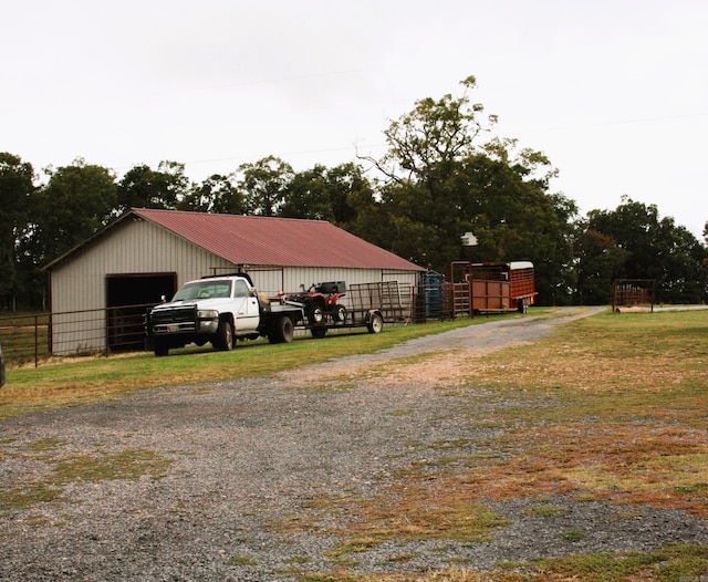 708 Kid Phillips Rd, Marshall, AR 72650 - exterior space with a garage, an outbuilding, a pole building, and fence