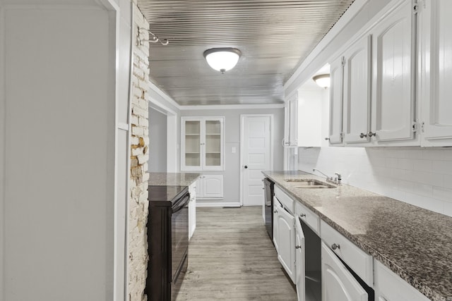 kitchen featuring white cabinets, black electric range oven, a sink, and dishwashing machine