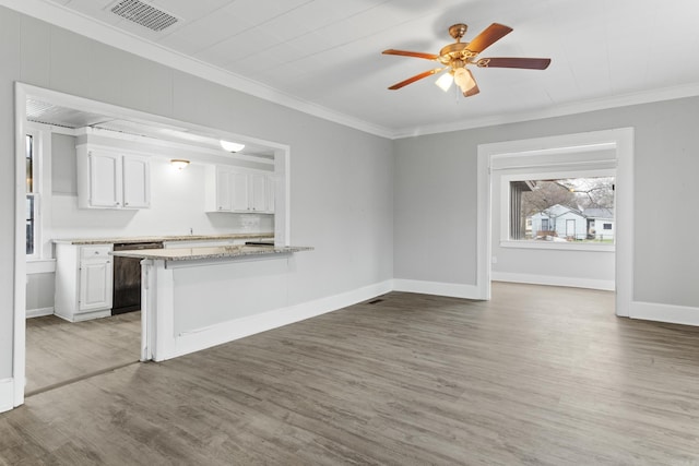 kitchen featuring dishwasher, ornamental molding, visible vents, and white cabinetry