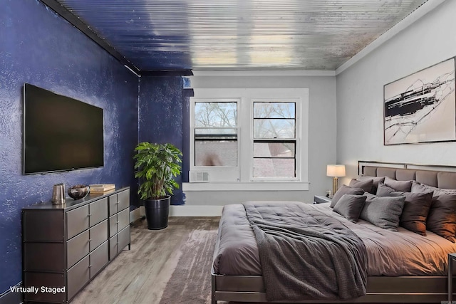 bedroom featuring wood finished floors