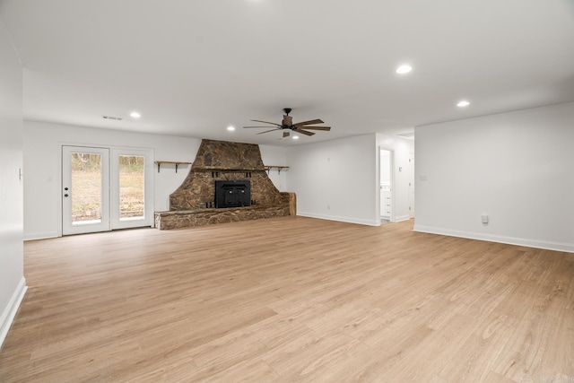 unfurnished living room with a ceiling fan, light wood-type flooring, baseboards, and recessed lighting