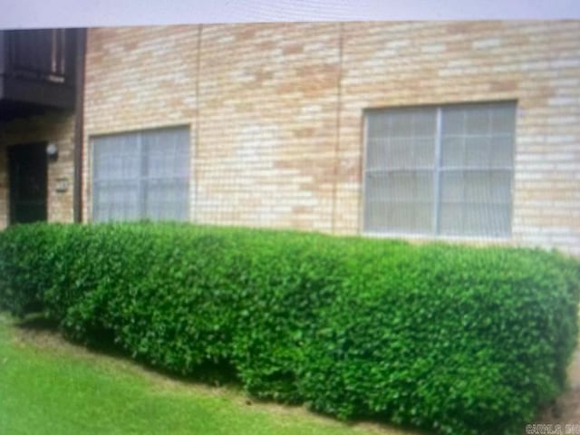 view of home's exterior with brick siding