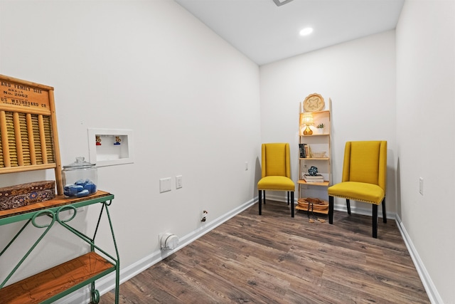 living area featuring recessed lighting, baseboards, and wood finished floors