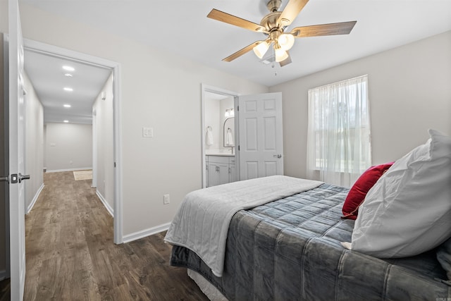 bedroom with ensuite bathroom, ceiling fan, recessed lighting, wood finished floors, and baseboards