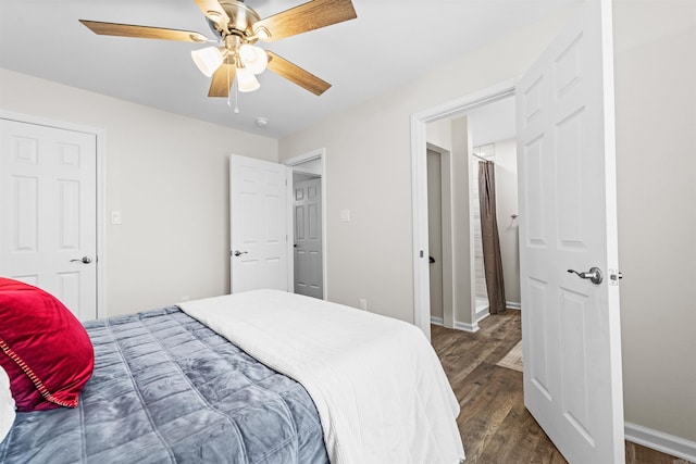 bedroom with dark wood-style floors, ceiling fan, and baseboards