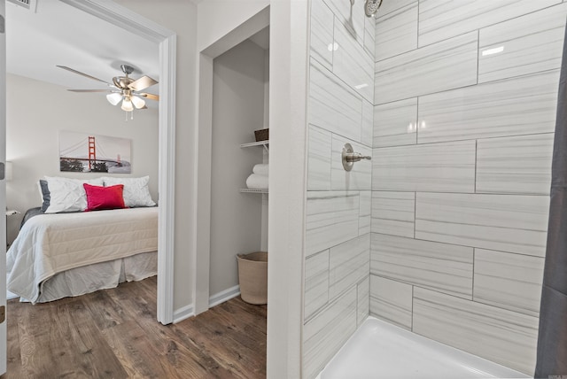 full bath featuring visible vents, a ceiling fan, ensuite bath, wood finished floors, and tiled shower