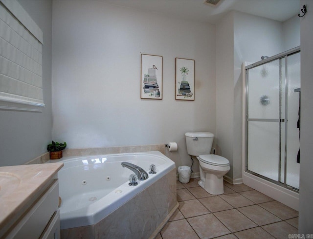 full bath with toilet, vanity, a shower stall, tile patterned floors, and a tub with jets