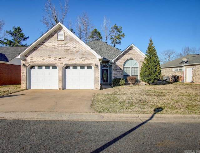 ranch-style home with an attached garage, brick siding, concrete driveway, roof with shingles, and a front yard