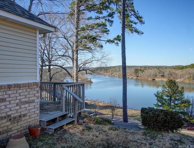 exterior space with a water view