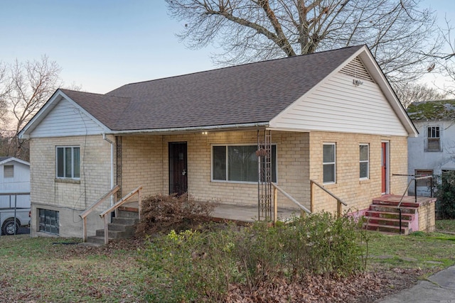 view of front of house featuring a shingled roof