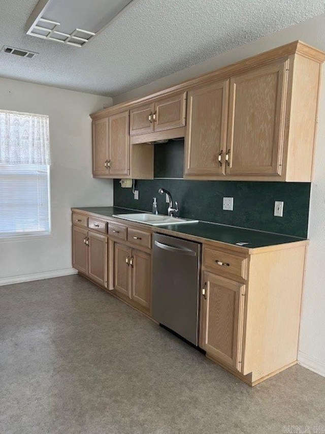 kitchen featuring baseboards, visible vents, dishwasher, dark countertops, and a textured ceiling