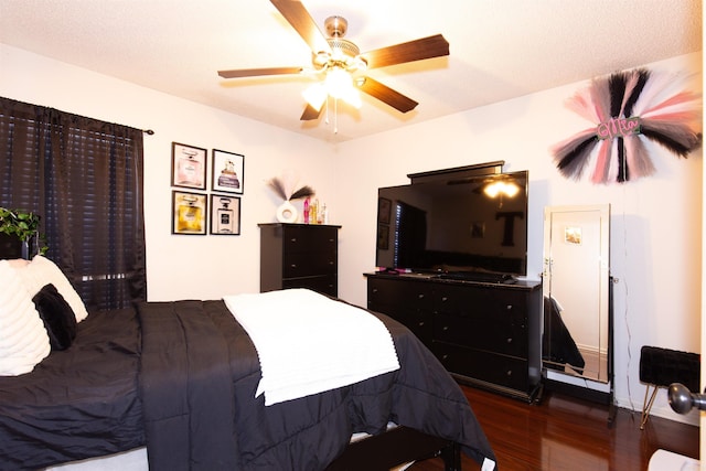 bedroom featuring ceiling fan and wood finished floors