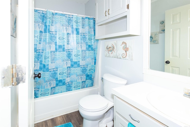 bathroom with toilet, shower / tub combo, wood finished floors, and vanity