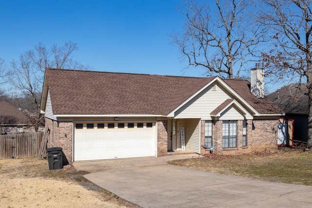 view of front of property with concrete driveway, brick siding, a chimney, and an attached garage