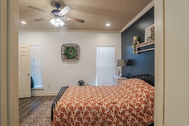 bedroom with recessed lighting, ornamental molding, a ceiling fan, wood finished floors, and baseboards