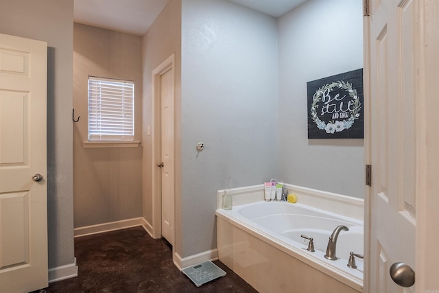 full bathroom with baseboards and a bath