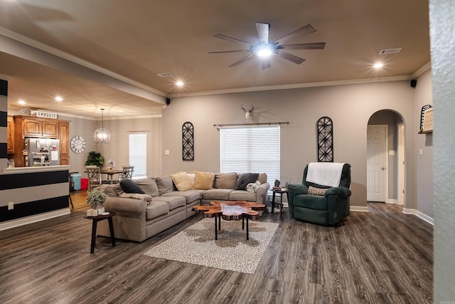 living room featuring arched walkways, dark wood-style flooring, recessed lighting, visible vents, and baseboards