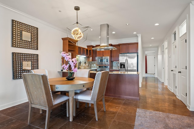 dining room with baseboards, ornamental molding, and recessed lighting