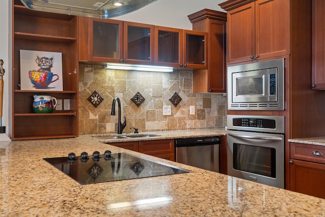 kitchen with open shelves, appliances with stainless steel finishes, a sink, and decorative backsplash