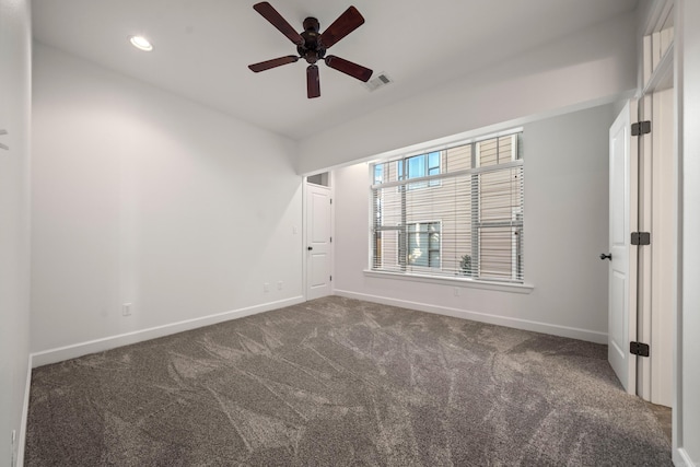 unfurnished bedroom with recessed lighting, carpet, visible vents, and baseboards