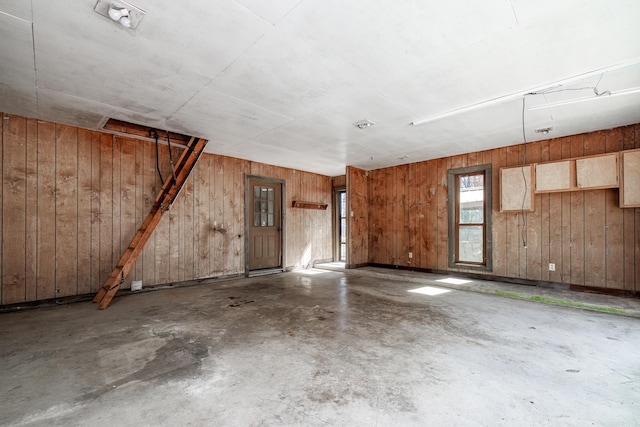 interior space featuring wood walls