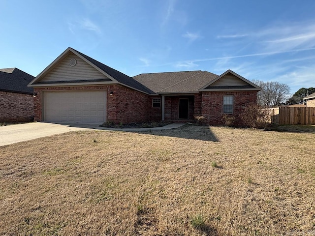 ranch-style house featuring a garage, fence, a front lawn, and brick siding