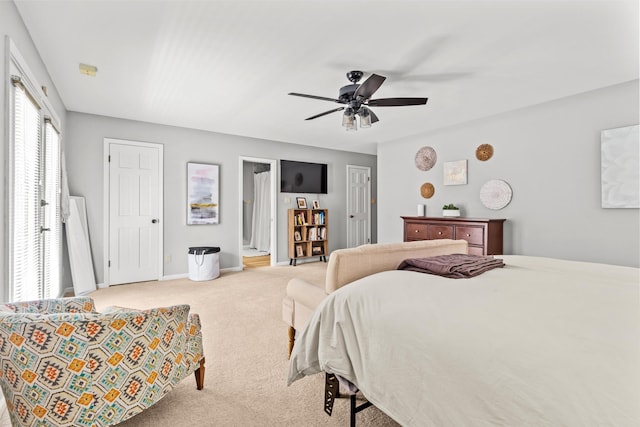 bedroom with baseboards, ceiling fan, and light colored carpet