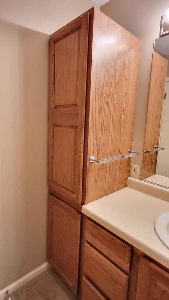 bathroom featuring vanity and baseboards