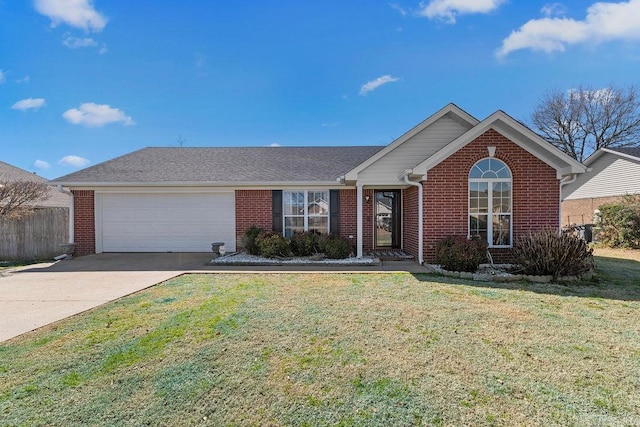 ranch-style home featuring a garage, a front yard, and brick siding