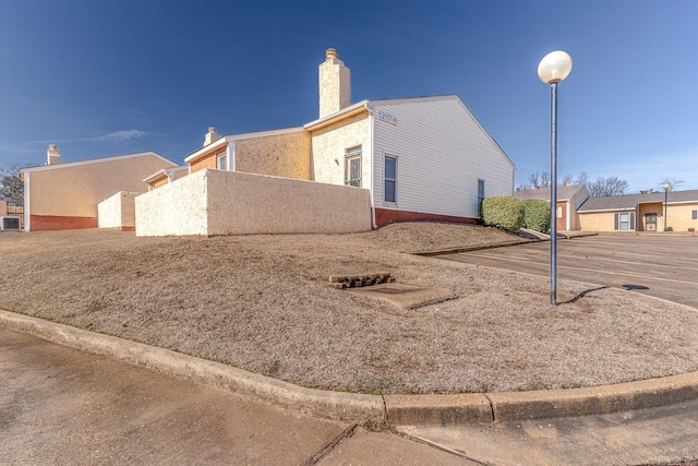 view of home's exterior with a chimney