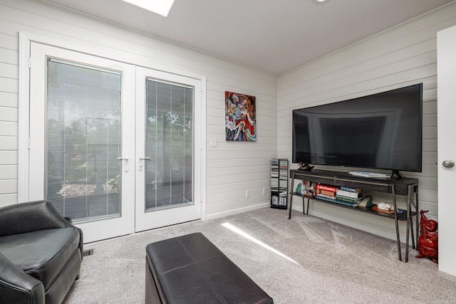 living area with french doors and carpet flooring