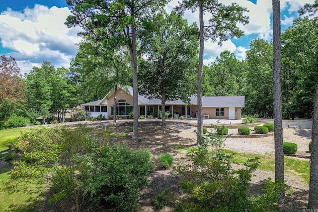 rear view of house with brick siding
